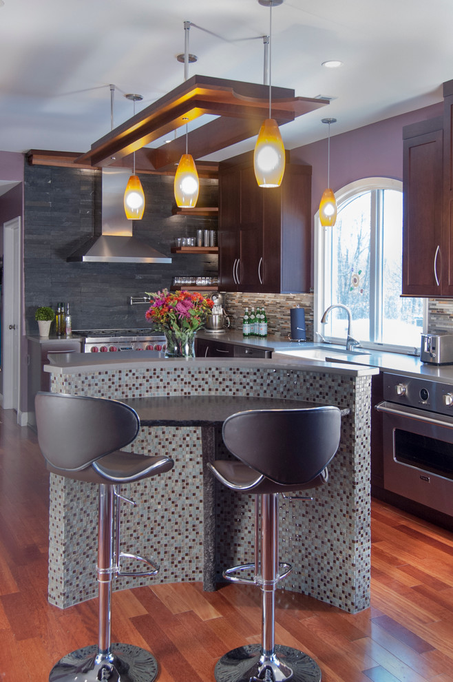 Eat-in kitchen - mid-sized asian l-shaped medium tone wood floor eat-in kitchen idea in Philadelphia with a farmhouse sink, shaker cabinets, dark wood cabinets, quartz countertops, multicolored backsplash, stainless steel appliances and an island