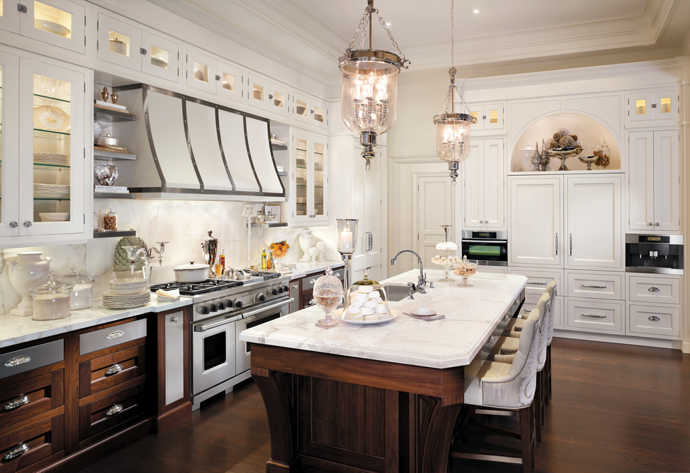 Example of a classic galley kitchen design in New York with recessed-panel cabinets, white cabinets and white backsplash