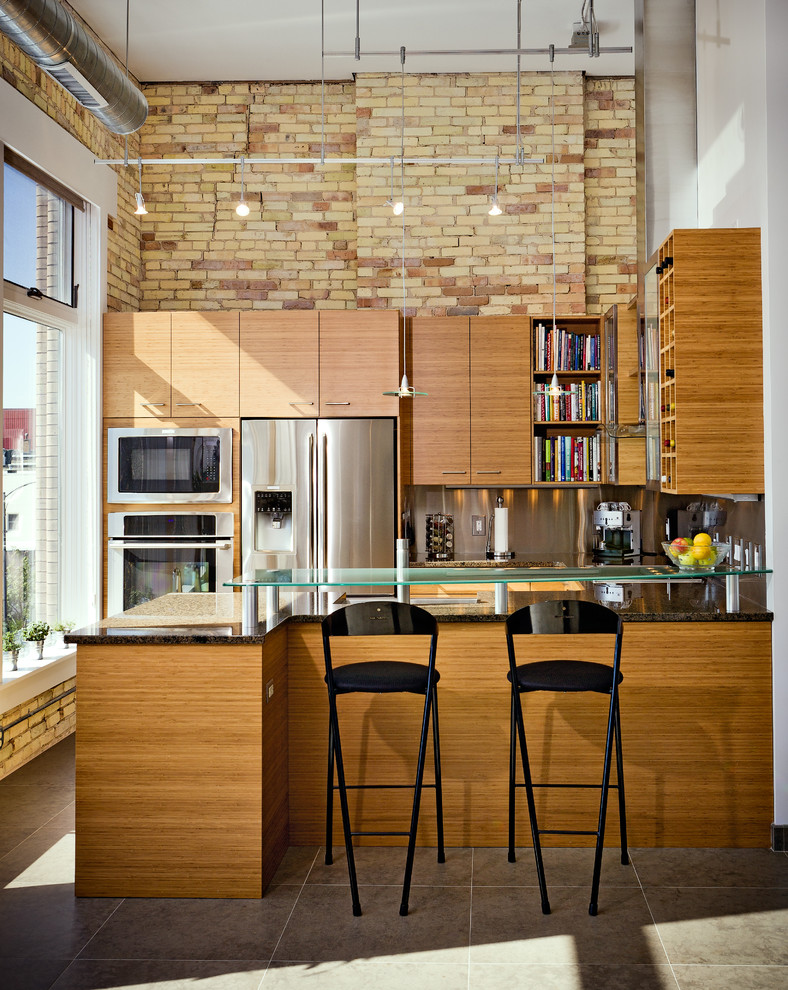 Inspiration for an industrial kitchen remodel in Other with flat-panel cabinets, medium tone wood cabinets, metallic backsplash, stainless steel appliances and a peninsula