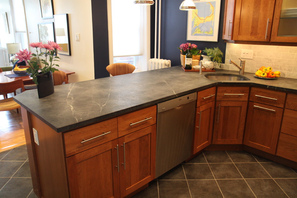 Example of a mid-sized classic l-shaped ceramic tile eat-in kitchen design in Philadelphia with a single-bowl sink, shaker cabinets, soapstone countertops, beige backsplash, ceramic backsplash, stainless steel appliances and an island