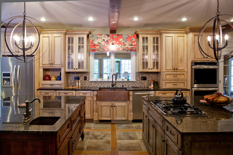 Eat-in kitchen - large traditional u-shaped ceramic tile eat-in kitchen idea in Cleveland with a farmhouse sink, recessed-panel cabinets, light wood cabinets, quartz countertops, brown backsplash, stone tile backsplash, stainless steel appliances and two islands
