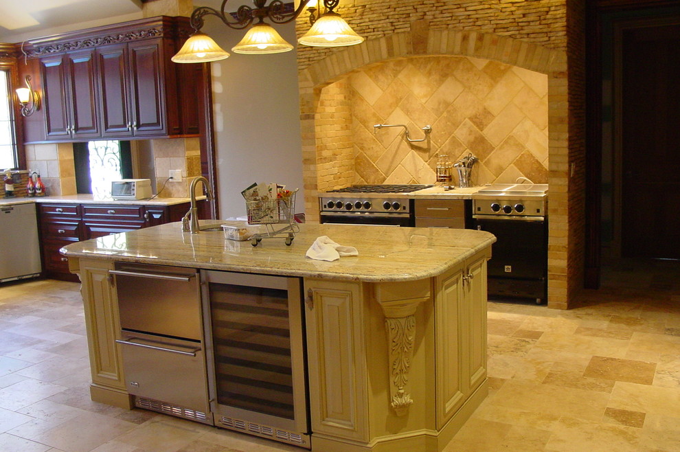 Large tuscan u-shaped eat-in kitchen photo in New York with a farmhouse sink, raised-panel cabinets, light wood cabinets, granite countertops, beige backsplash, terra-cotta backsplash and stainless steel appliances