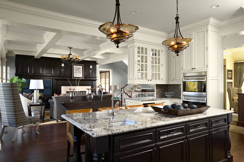 Huge elegant dark wood floor open concept kitchen photo in Minneapolis with granite countertops, black cabinets, stainless steel appliances and an island