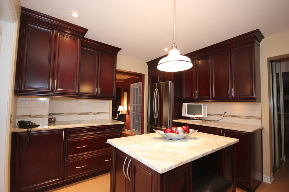 Enclosed kitchen - mid-sized traditional u-shaped linoleum floor enclosed kitchen idea in Ottawa with an undermount sink, raised-panel cabinets, dark wood cabinets, granite countertops, stainless steel appliances and an island