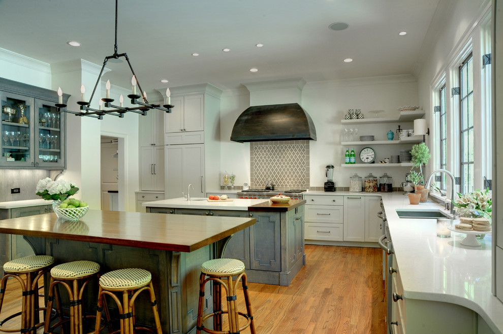 Kitchen - traditional kitchen idea in Atlanta with white cabinets and beige backsplash