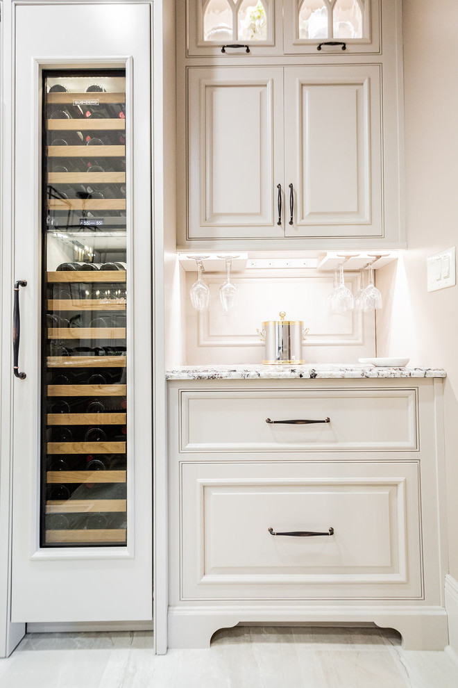 Inspiration for a large transitional porcelain tile and beige floor kitchen remodel in Other with a farmhouse sink, beaded inset cabinets, gray cabinets, granite countertops, porcelain backsplash, stainless steel appliances, an island and beige countertops