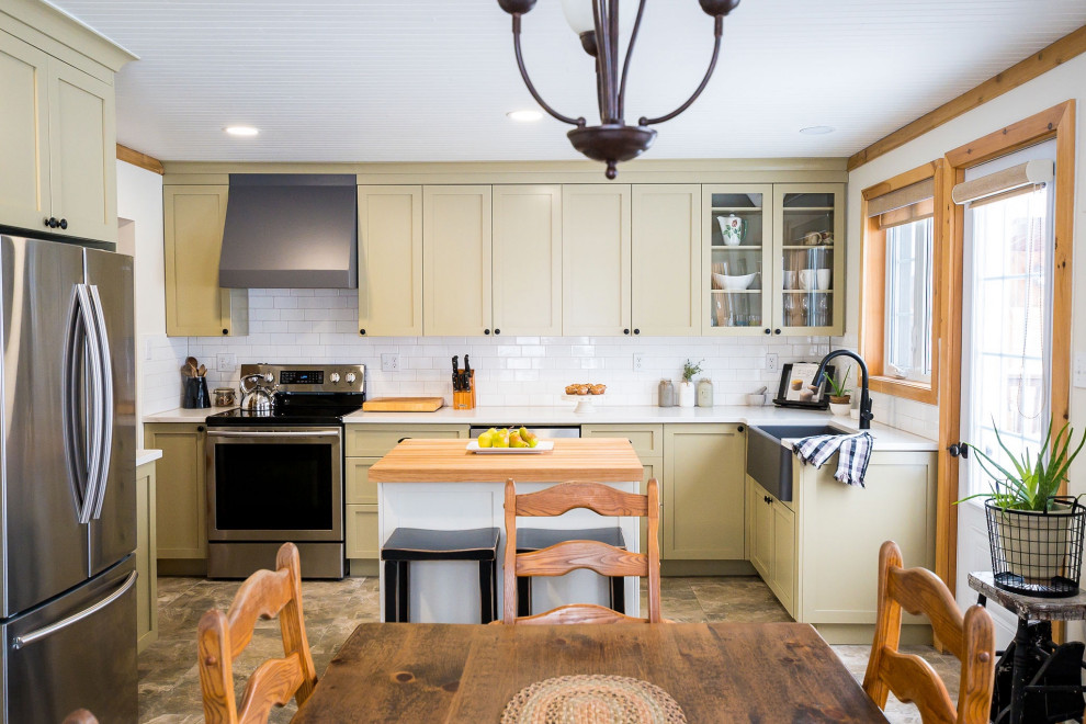 Inspiration for a small farmhouse l-shaped ceramic tile, beige floor and shiplap ceiling eat-in kitchen remodel with a farmhouse sink, shaker cabinets, green cabinets, quartz countertops, white backsplash, ceramic backsplash, stainless steel appliances, an island and white countertops