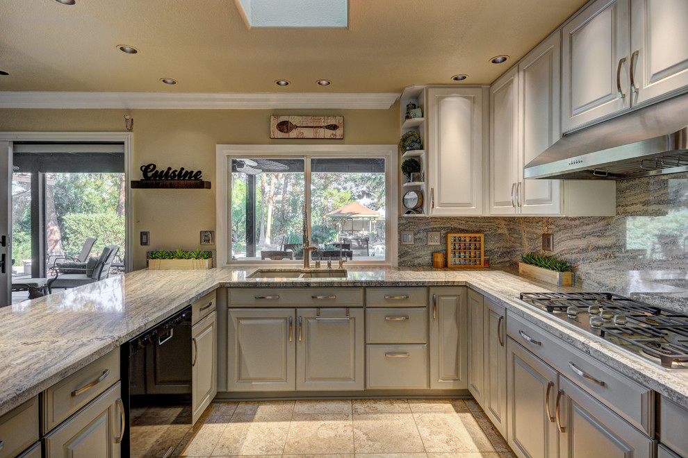 Kitchen - large contemporary u-shaped kitchen idea in Las Vegas with a double-bowl sink, gray cabinets, granite countertops, gray backsplash, stone slab backsplash and black appliances