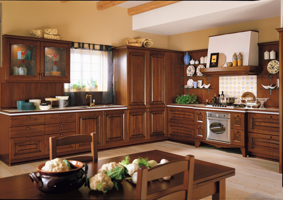 Mid-sized tuscan l-shaped light wood floor eat-in kitchen photo in San Diego with a double-bowl sink, flat-panel cabinets, medium tone wood cabinets, quartz countertops, brown backsplash, terra-cotta backsplash, paneled appliances and an island