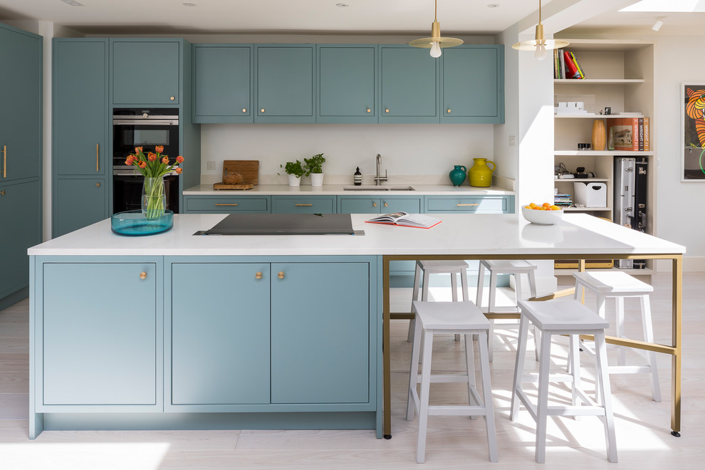 Inspiration for a contemporary open plan kitchen in London with an island.
