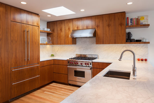 Eat-in kitchen - mid-sized contemporary u-shaped light wood floor eat-in kitchen idea in San Francisco with an undermount sink, flat-panel cabinets, dark wood cabinets, marble countertops, white backsplash, stone slab backsplash, stainless steel appliances and no island