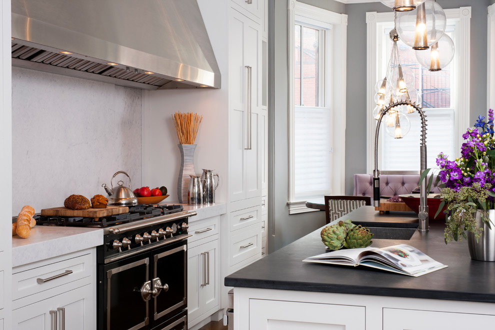 Example of a large transitional galley dark wood floor eat-in kitchen design in DC Metro with a single-bowl sink, shaker cabinets, white cabinets, soapstone countertops, white backsplash, stone slab backsplash, an island and black appliances