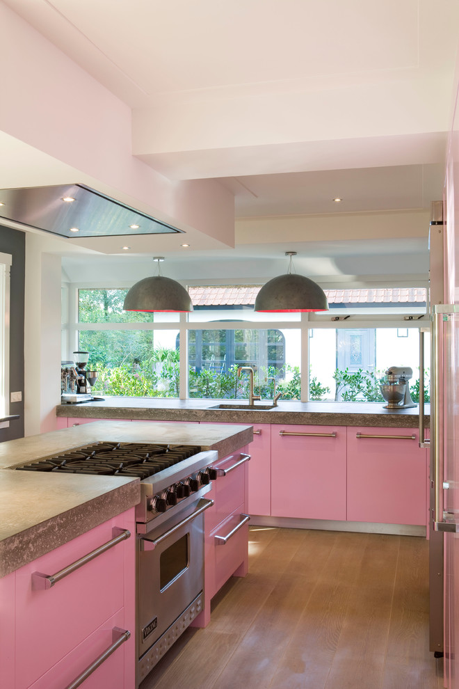 Inspiration for a modern kitchen remodel in New York with concrete countertops and stainless steel appliances