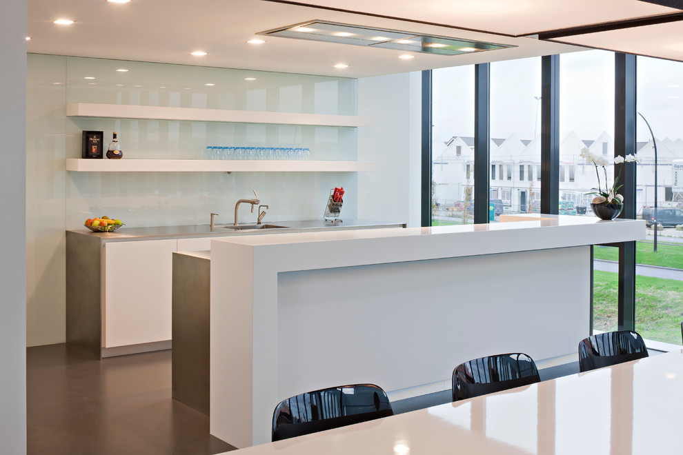 Design ideas for a modern kitchen in New York with stainless steel worktops and grey worktops.