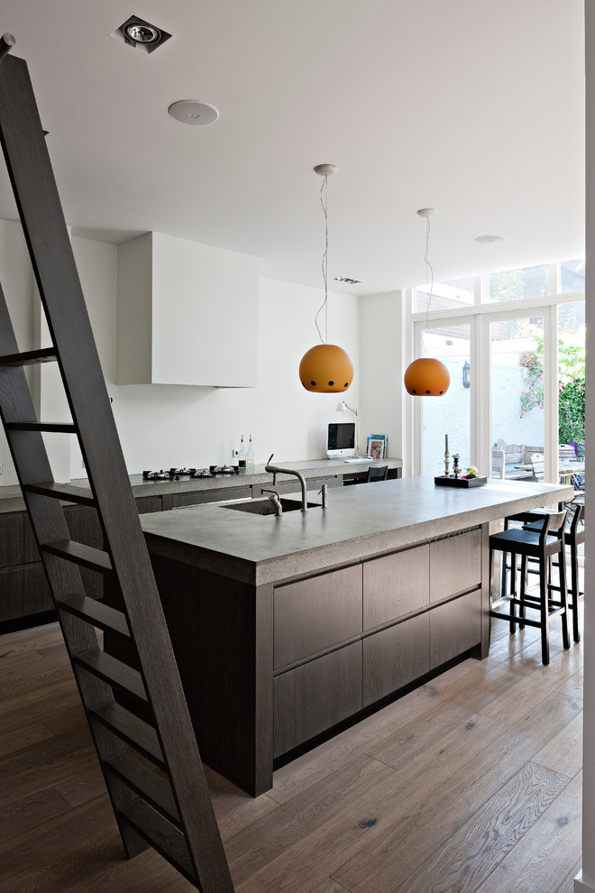 Inspiration for a modern kitchen remodel in New York with concrete countertops