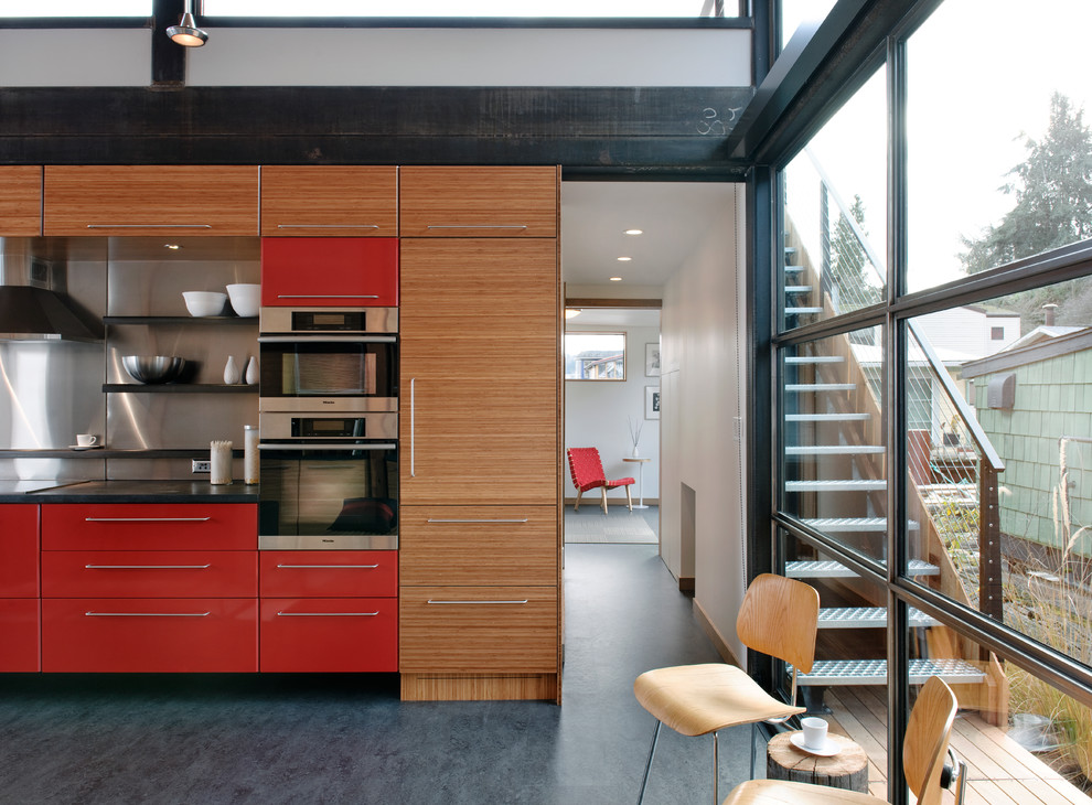Example of an urban kitchen design in Seattle with red cabinets