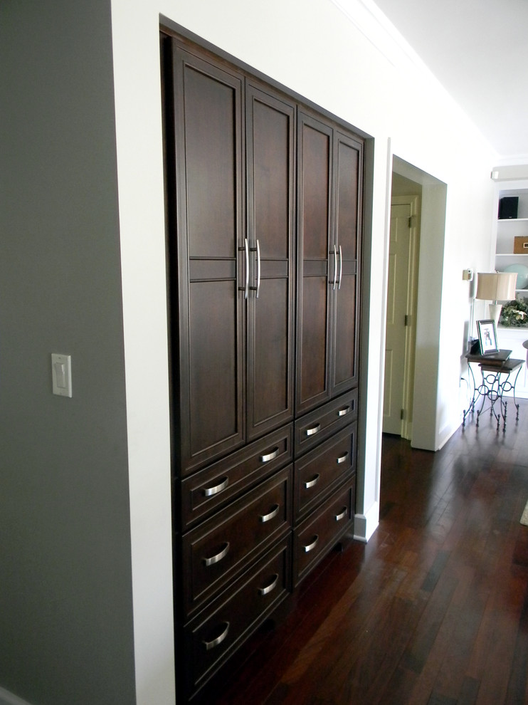 Example of a mid-sized classic l-shaped dark wood floor eat-in kitchen design in Other with recessed-panel cabinets, dark wood cabinets and an island
