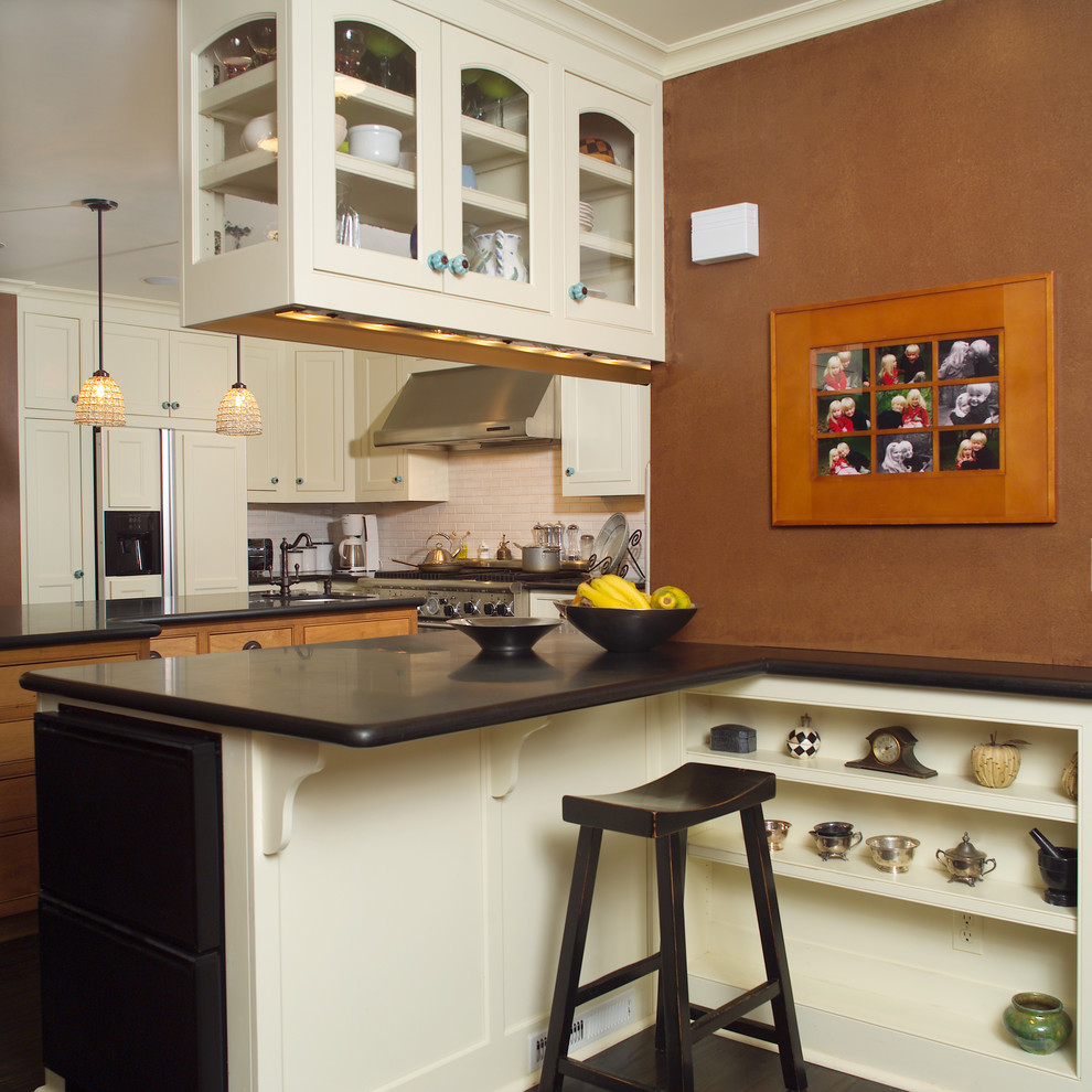 Example of an eclectic kitchen design in San Francisco with beige cabinets, granite countertops, white backsplash and subway tile backsplash