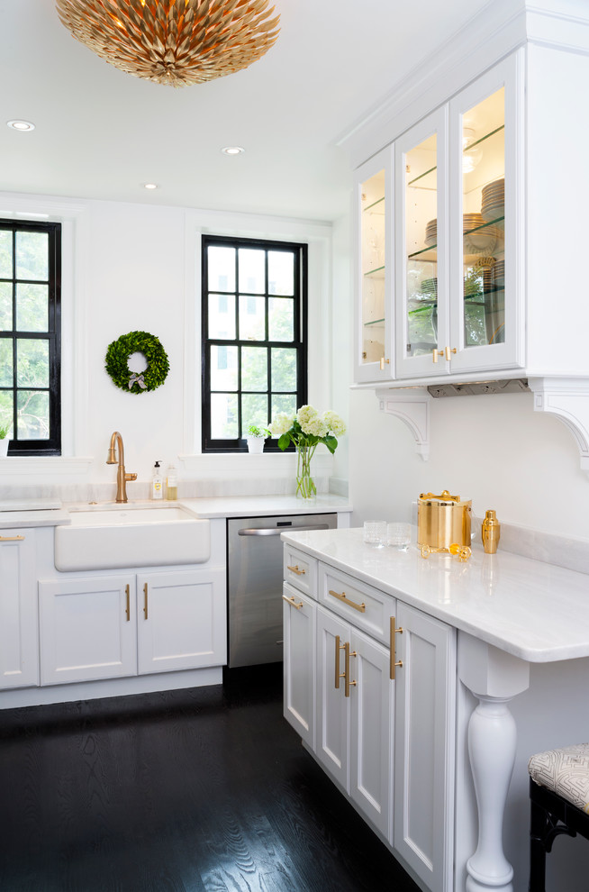 Enclosed kitchen - transitional galley painted wood floor and black floor enclosed kitchen idea in DC Metro with shaker cabinets, white cabinets, quartzite countertops, white backsplash, subway tile backsplash, stainless steel appliances and a farmhouse sink
