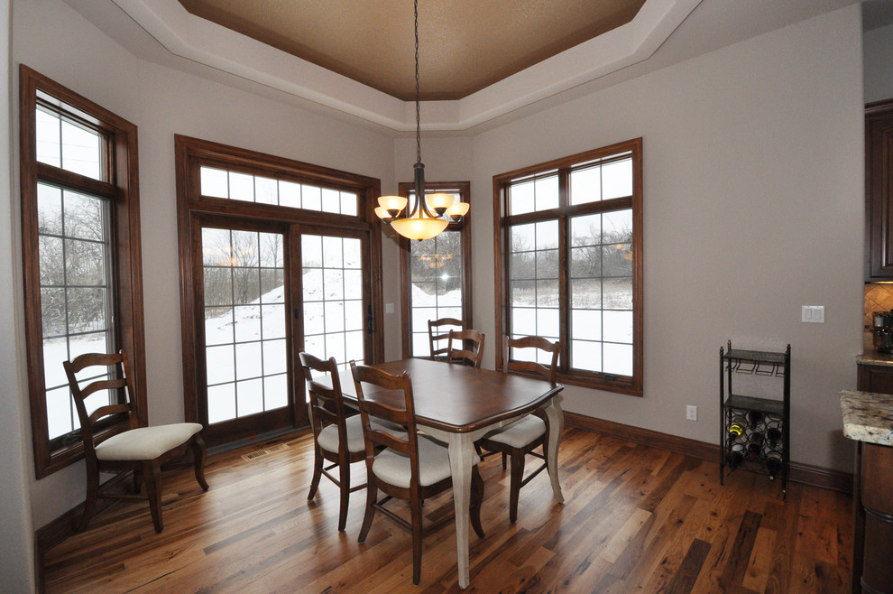 Large traditional kitchen/dining room in Milwaukee with medium hardwood flooring.