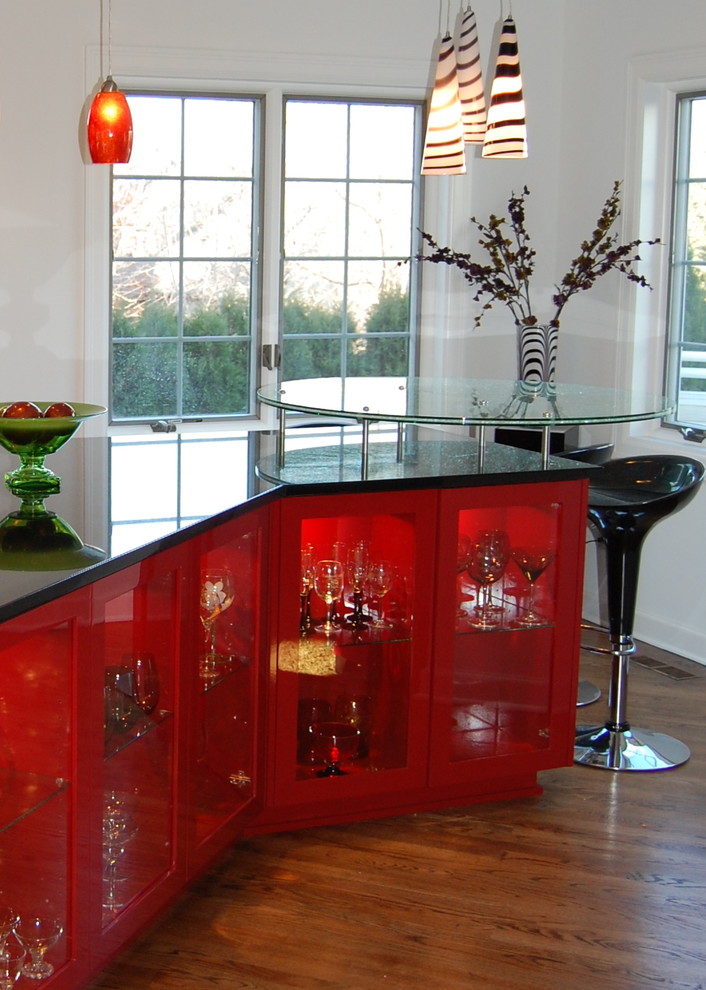Trendy medium tone wood floor kitchen photo in Minneapolis with glass-front cabinets and red cabinets