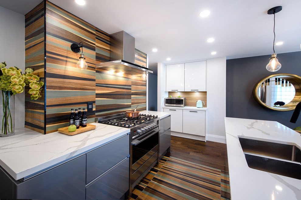 Eat-in kitchen - small contemporary brown floor eat-in kitchen idea in Other with a drop-in sink, flat-panel cabinets, gray cabinets, multicolored backsplash, stainless steel appliances, an island and white countertops