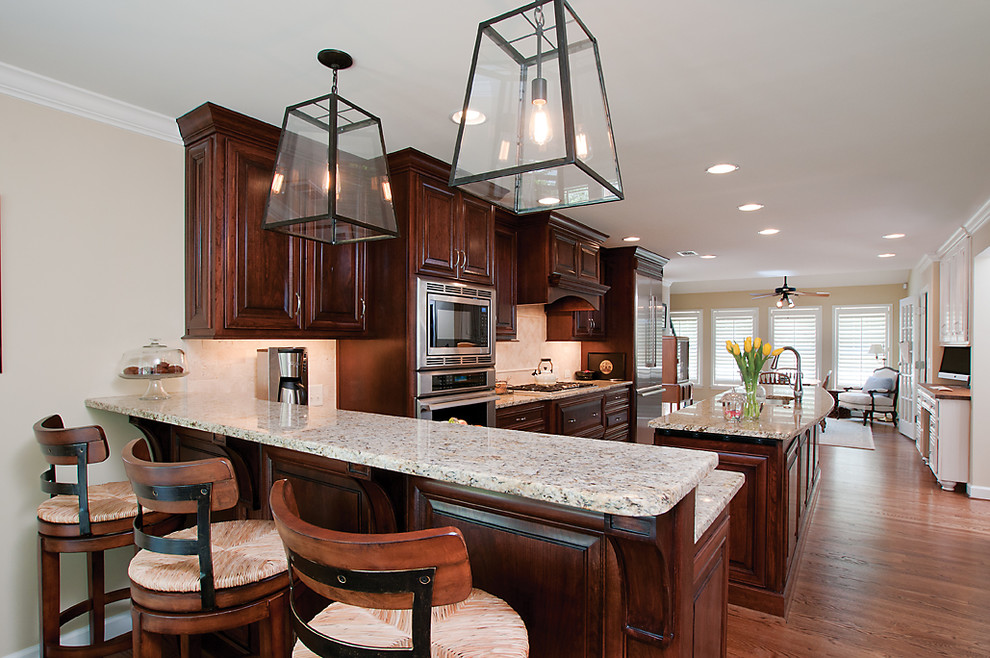 Inspiration for a traditional kitchen in Atlanta with raised-panel cabinets and stainless steel appliances.