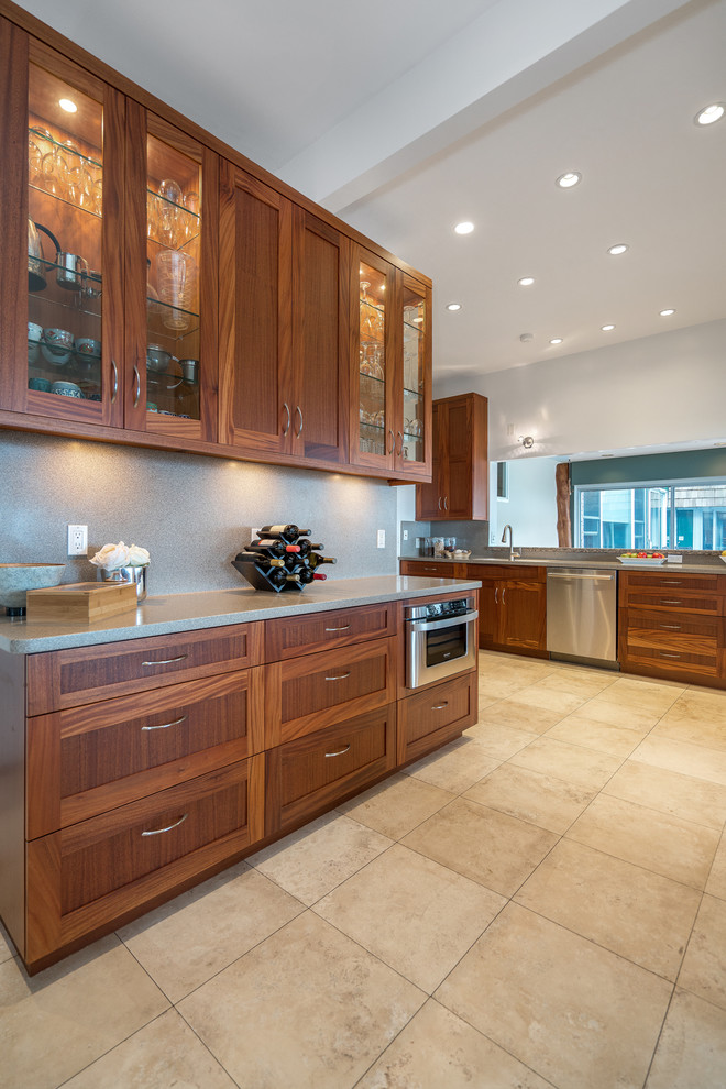 Large island style l-shaped ceramic tile and beige floor eat-in kitchen photo in Hawaii with shaker cabinets, medium tone wood cabinets, an undermount sink, granite countertops, gray backsplash, stone slab backsplash, stainless steel appliances and no island