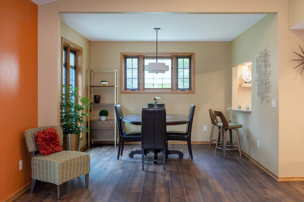 This is an example of a classic kitchen/dining room in Other with vinyl flooring and brown floors.