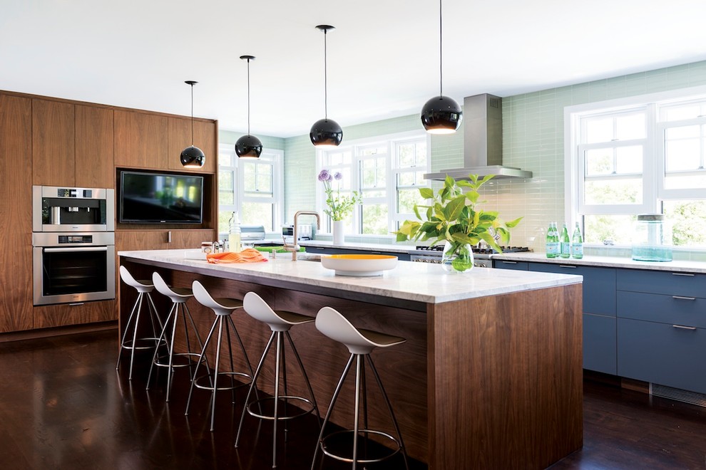 Inspiration for a mid-sized contemporary l-shaped dark wood floor kitchen remodel in Boston with an undermount sink, flat-panel cabinets, medium tone wood cabinets, marble countertops, green backsplash, glass tile backsplash, stainless steel appliances and an island