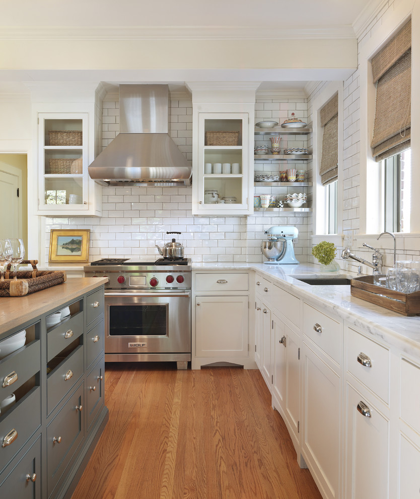 Example of a classic kitchen design in Providence with stainless steel appliances, an undermount sink, beaded inset cabinets, white cabinets, white backsplash and subway tile backsplash