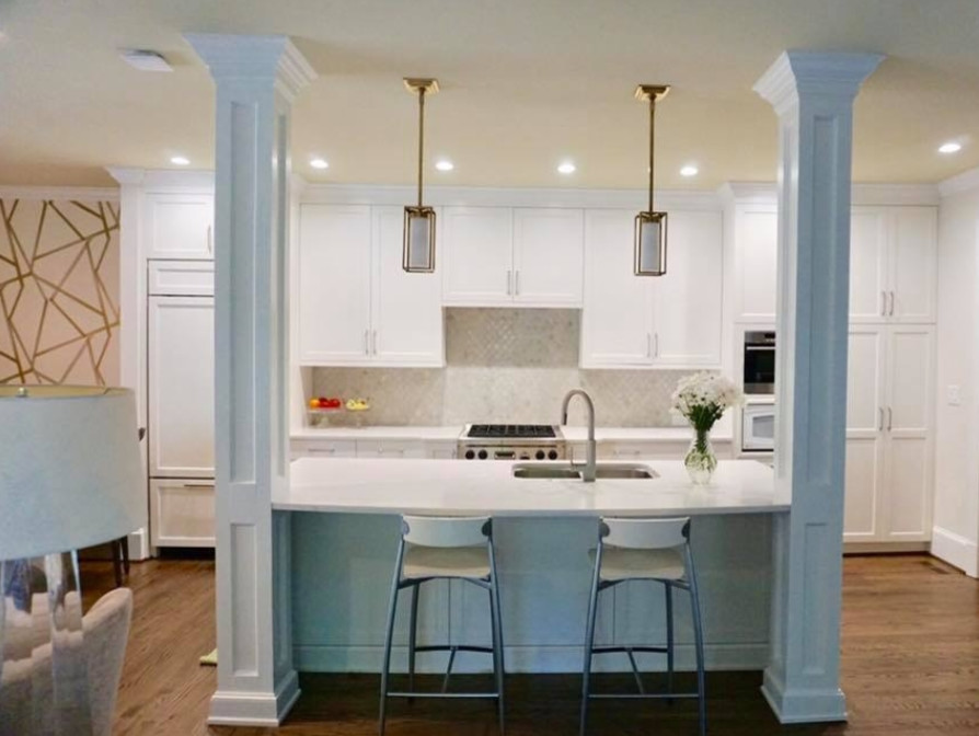 Inspiration for a mid-sized transitional l-shaped brown floor and dark wood floor kitchen remodel in Charlotte with an undermount sink, shaker cabinets, white cabinets, marble countertops, white backsplash, glass tile backsplash, paneled appliances and an island