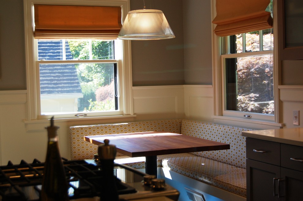 Transitional kitchen photo in Portland with an island