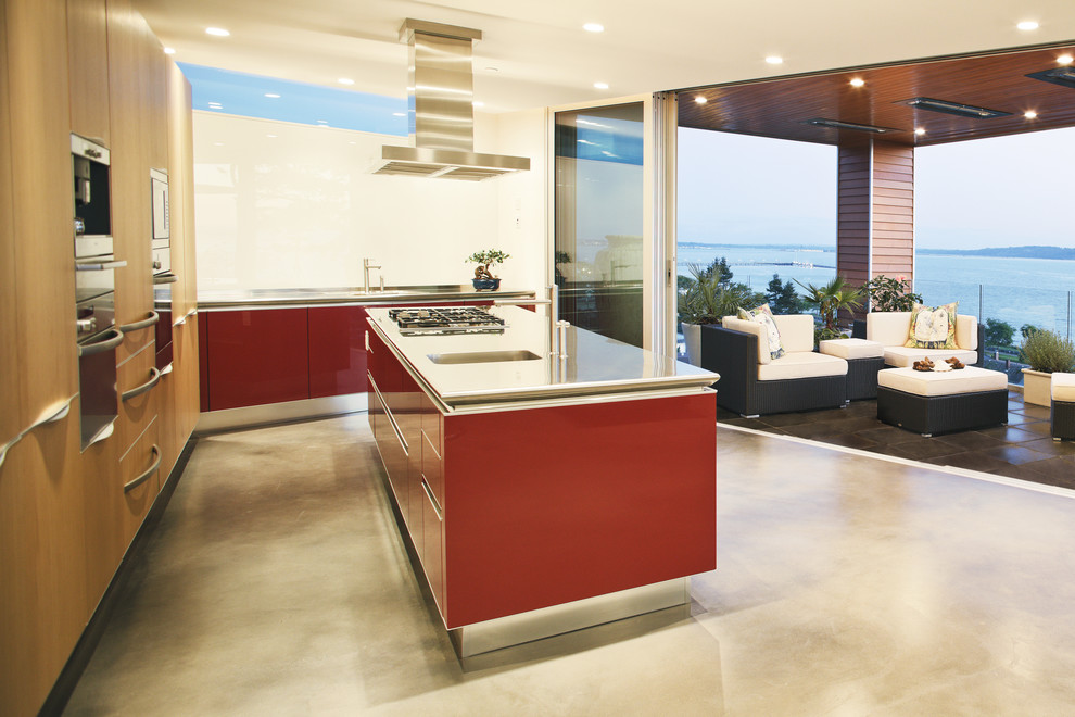 Example of a minimalist kitchen design in Vancouver with stainless steel appliances