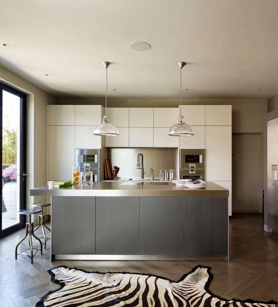 Photo of a contemporary kitchen in Cheshire with an island.
