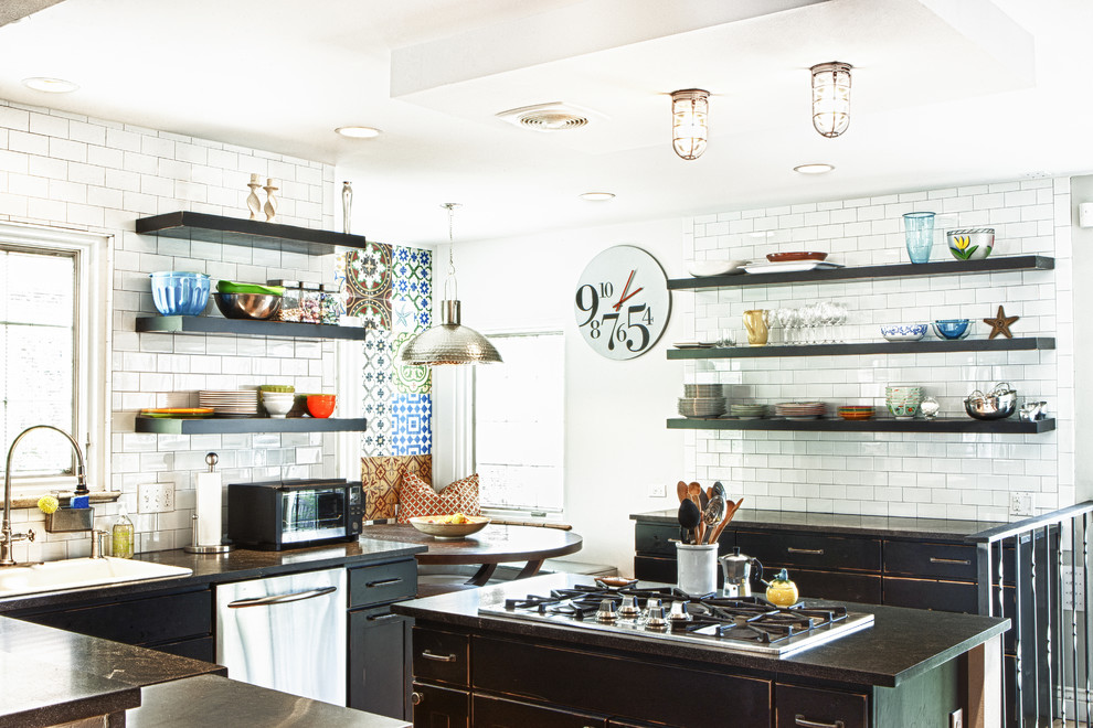 Inspiration for an eclectic kitchen remodel in Denver with subway tile backsplash, stainless steel appliances, open cabinets, distressed cabinets and white backsplash