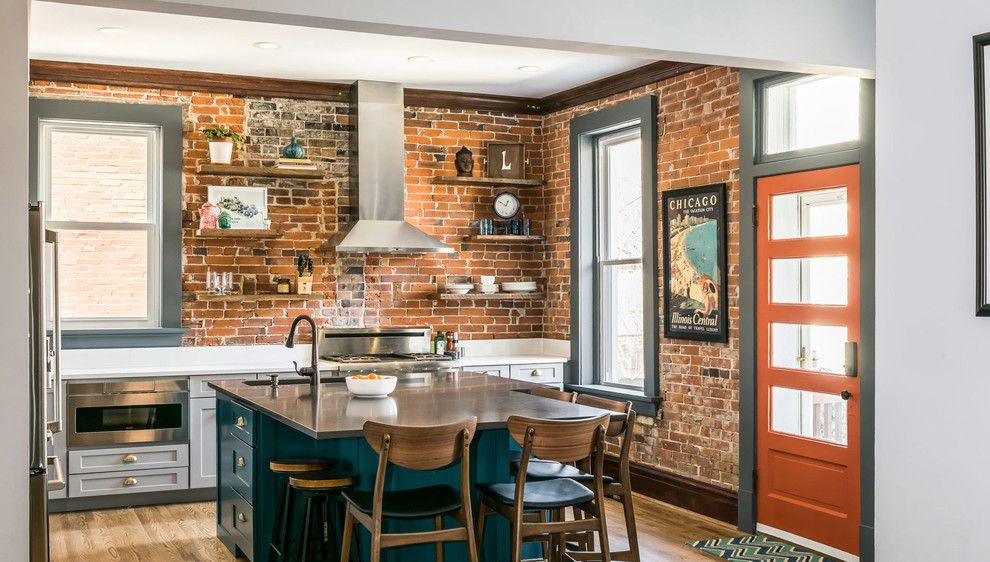 Eat-in kitchen - mid-sized eclectic l-shaped light wood floor and brown floor eat-in kitchen idea with a drop-in sink, recessed-panel cabinets, turquoise cabinets, quartz countertops, stainless steel appliances, an island and white countertops