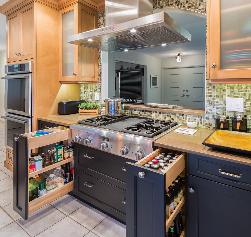 Medium sized eclectic galley kitchen/diner in Tampa with recessed-panel cabinets, black cabinets, engineered stone countertops, multi-coloured splashback, glass tiled splashback, stainless steel appliances, a belfast sink and ceramic flooring.