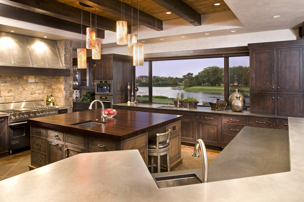 Example of a mountain style kitchen design in Minneapolis with stainless steel appliances