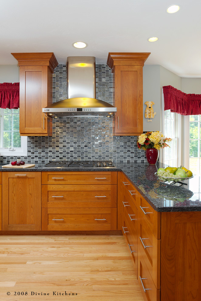 Eat-in kitchen - large eclectic galley light wood floor eat-in kitchen idea in Boston with a double-bowl sink, shaker cabinets, medium tone wood cabinets, granite countertops, blue backsplash, mosaic tile backsplash, stainless steel appliances and no island
