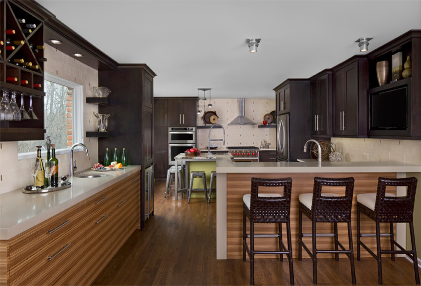 Inspiration for an eclectic u-shaped eat-in kitchen remodel in Detroit with recessed-panel cabinets, green cabinets, quartzite countertops and an island