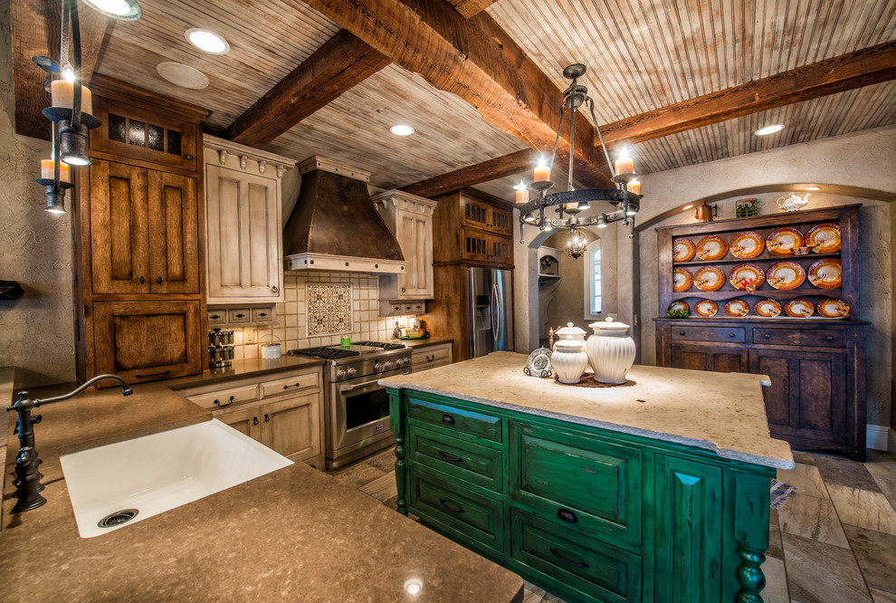 Inspiration for a large rustic u-shaped porcelain tile kitchen remodel in Other with stainless steel appliances, a farmhouse sink, shaker cabinets, distressed cabinets, quartz countertops, white backsplash, porcelain backsplash and an island