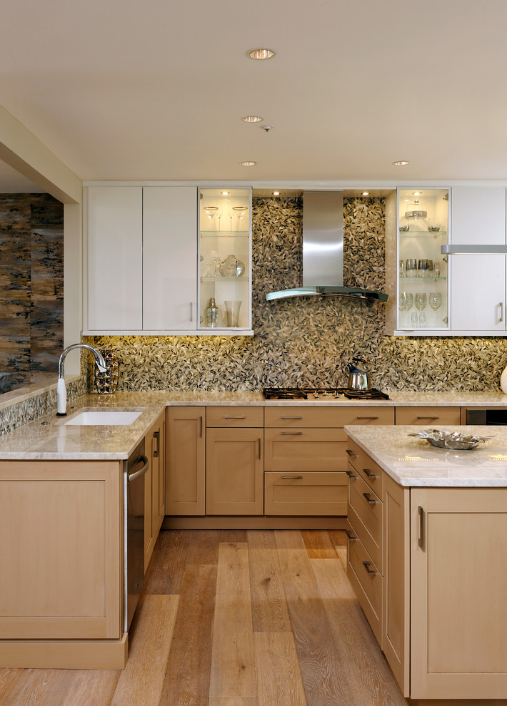 Classic l-shaped kitchen/diner in DC Metro with a submerged sink, shaker cabinets, light wood cabinets, quartz worktops, multi-coloured splashback, mosaic tiled splashback, stainless steel appliances, medium hardwood flooring and an island.