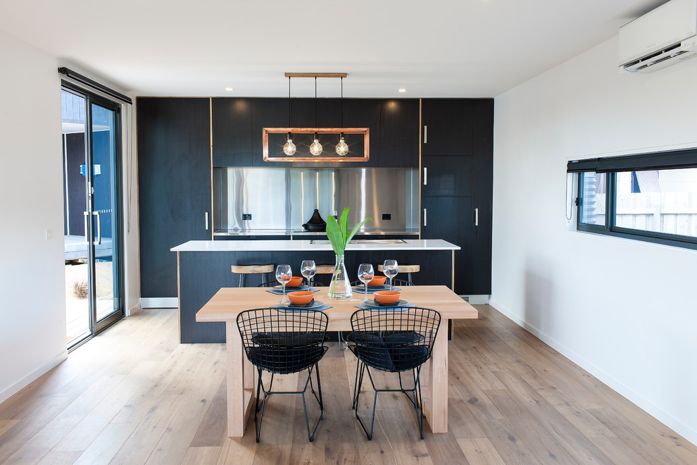 Photo of a contemporary kitchen in Melbourne with black cabinets.