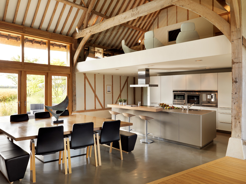 Inspiration for a contemporary open plan kitchen in Cheshire with an island.