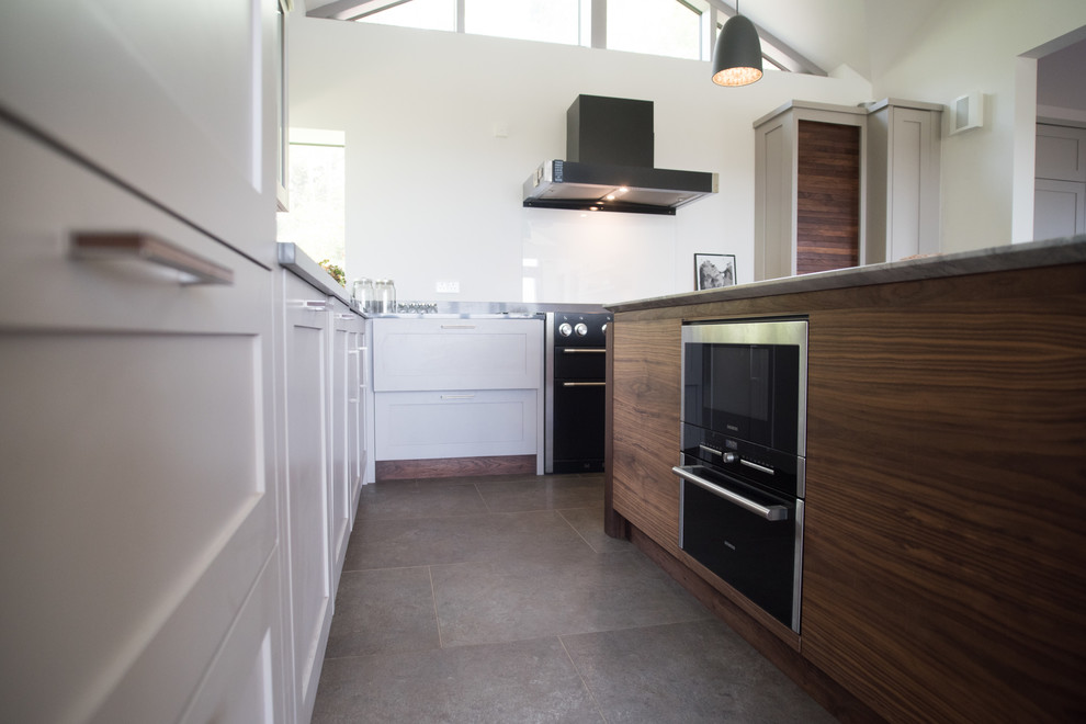 Expansive contemporary kitchen in Cornwall with a double-bowl sink and ceramic flooring.