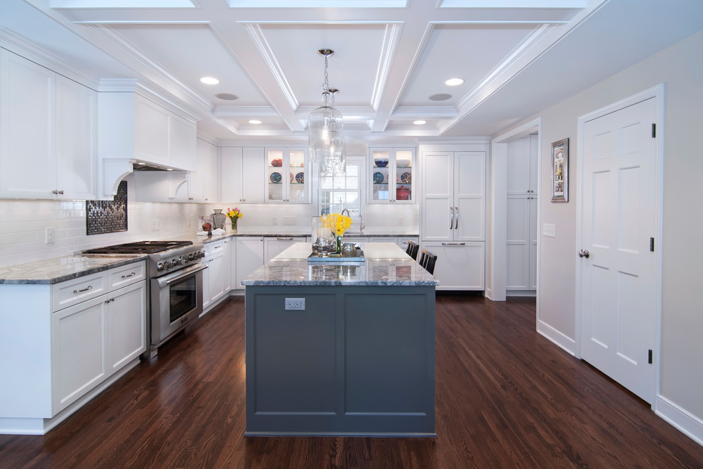 Inspiration for a timeless l-shaped kitchen remodel in Minneapolis with paneled appliances, granite countertops, shaker cabinets, white cabinets, white backsplash and subway tile backsplash