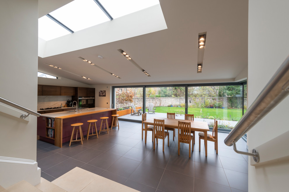 This is an example of a large contemporary kitchen in Other with flat-panel cabinets, purple cabinets, marble worktops, an island, grey floors and white worktops.