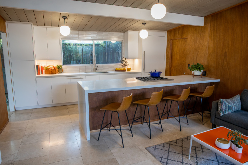 Retro kitchen/diner in San Francisco with flat-panel cabinets.