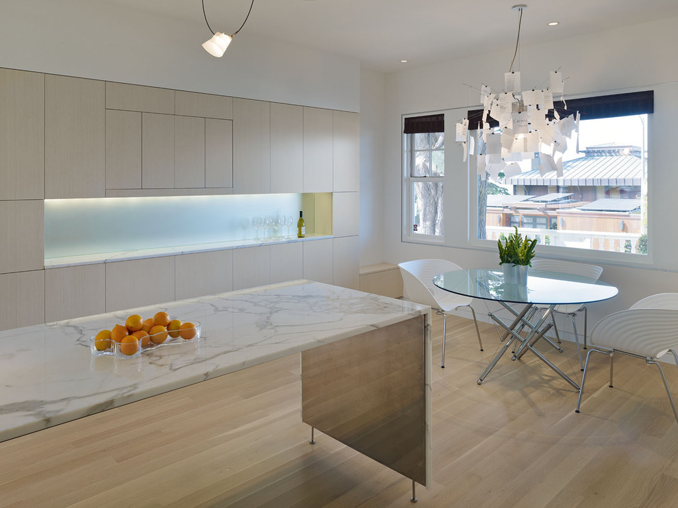 Modern kitchen in San Francisco with flat-panel cabinets and light wood cabinets.